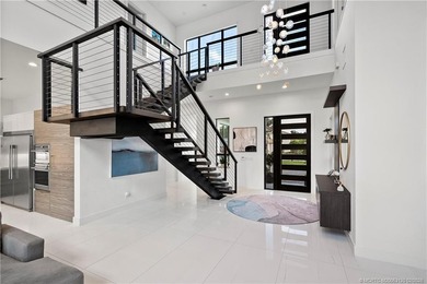 Experience modern waterfront luxury in this stunning - photo 9