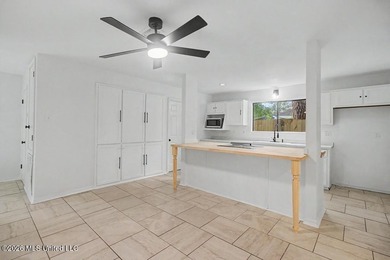 Adorable home in Diamondhead featuring stainless steel - photo 9