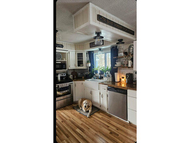 Nestled in a peaceful, private setting, this charming home - photo 11
