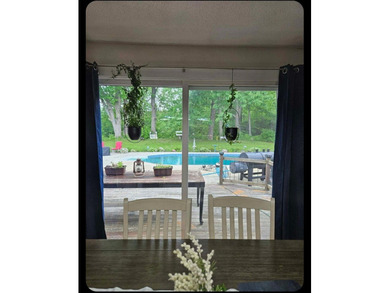 Nestled in a peaceful, private setting, this charming home - photo 12