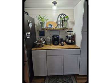 Nestled in a peaceful, private setting, this charming home - photo 18
