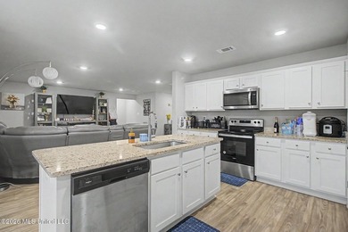 Welcome home to this spacious 4-bedroom, 2-bath property - photo 2