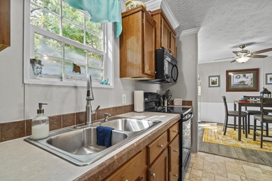 Three-bedroom, two-bathroom, single-story manufactured home with - photo 13