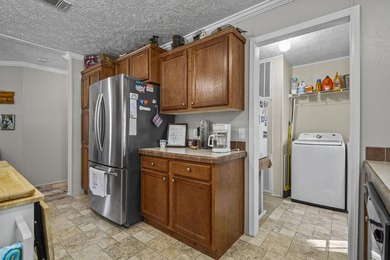 Three-bedroom, two-bathroom, single-story manufactured home with - photo 17