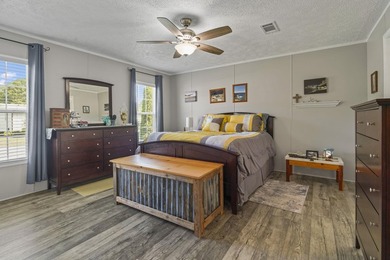 Three-bedroom, two-bathroom, single-story manufactured home with - photo 21