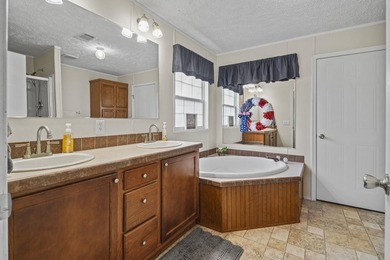 Three-bedroom, two-bathroom, single-story manufactured home with - photo 23