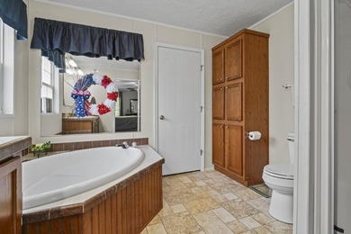 Three-bedroom, two-bathroom, single-story manufactured home with - photo 24