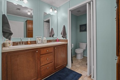 Three-bedroom, two-bathroom, single-story manufactured home with - photo 28