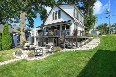 50 feet of prime frontage on Pewaukee Lake. Taken down to the - photo 25