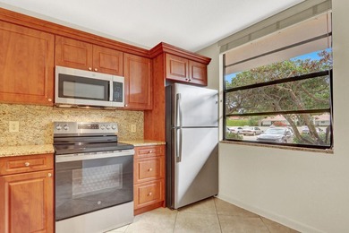 Move-in ready first floor unit, just steps from the - photo 2