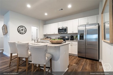 The Gwinnett II is a well-designed one-story home featuring four - photo 5