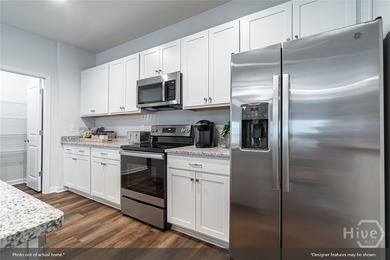The Gwinnett II is a well-designed one-story home featuring four - photo 6