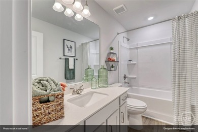 The Lawrence is a thoughtfully designed one-story home featuring - photo 4