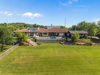 Set on an expansive nearly 14-acre estate, 321 Verna Trail N is - photo 1