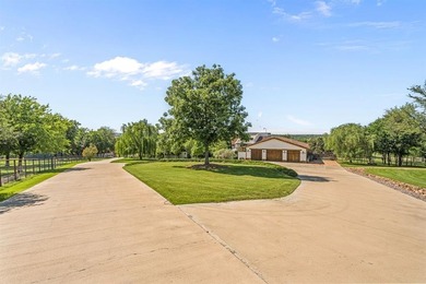 Set on an expansive nearly 14-acre estate, 321 Verna Trail N is - photo 2