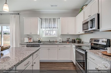 The Russell is a versatile two-story home featuring four - photo 5