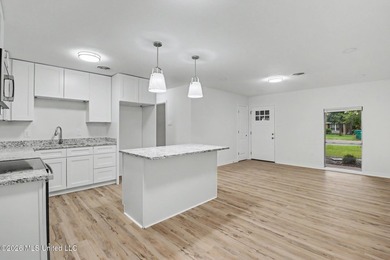 Completely renovated and move-in ready, this stunning 3-bedroom - photo 2