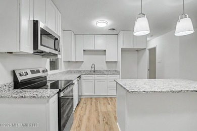 Completely renovated and move-in ready, this stunning 3-bedroom - photo 3