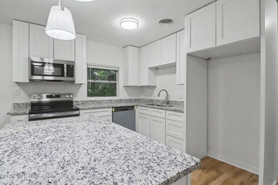 Completely renovated and move-in ready, this stunning 3-bedroom - photo 4