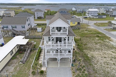 Located in North Topsail Beach, this custom-featured, truly