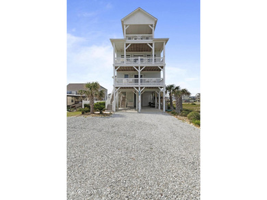 Located in North Topsail Beach, this custom-featured, truly