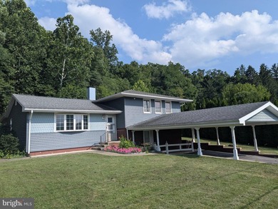 This charming split-level home, built in 1960, offers a perfect - photo 1