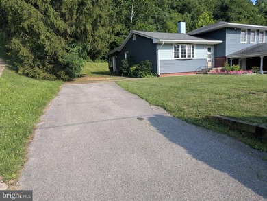 This charming split-level home, built in 1960, offers a perfect - photo 5