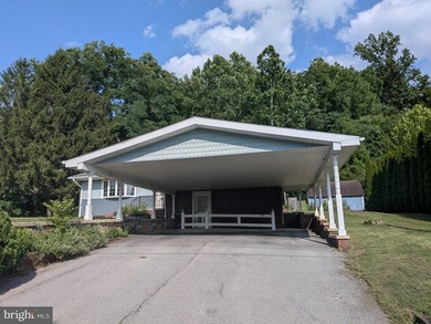 This charming split-level home, built in 1960, offers a perfect - photo 6