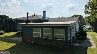 This charming split-level home, built in 1960, offers a perfect - photo 9