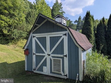 This charming split-level home, built in 1960, offers a perfect - photo 10