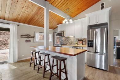 Edgewater Terrace is home to this peaceful, wooded setting on - photo 3