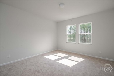 The Dunlin floorplan features an open, easy-living layout in a - photo 8