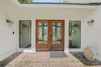 Set on a generous private lot at the end of a quiet street, this - photo 3