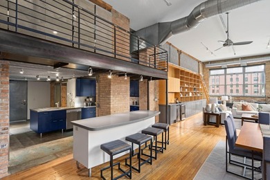 Located in the historic 801 lofts, this authentic loft offers a - photo 16