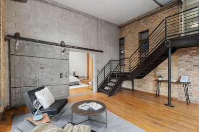 Located in the historic 801 lofts, this authentic loft offers a - photo 19