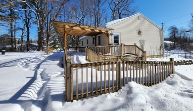 This sunny, well-landscaped ranch is located in-town in a