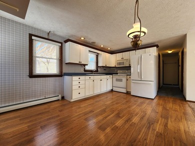 This sunny, well-landscaped ranch is located in-town in a