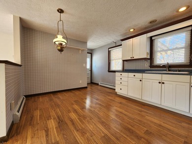 This sunny, well-landscaped ranch is located in-town in a