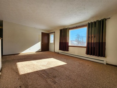 This sunny, well-landscaped ranch is located in-town in a