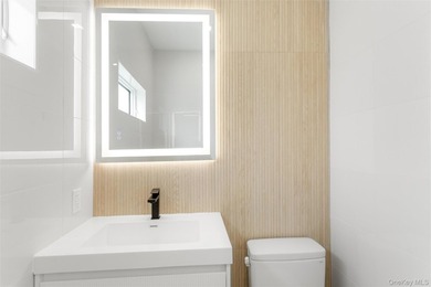 Welcome to elevated coastal living in this newly constructed - photo 12