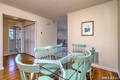 This gorgeous, sun-splashed end-unit townhouse-originally the