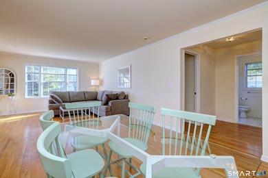 This gorgeous, sun-splashed end-unit townhouse-originally the