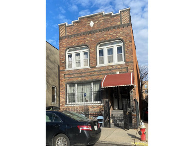 Detached all brick three family building full basement with - photo 1