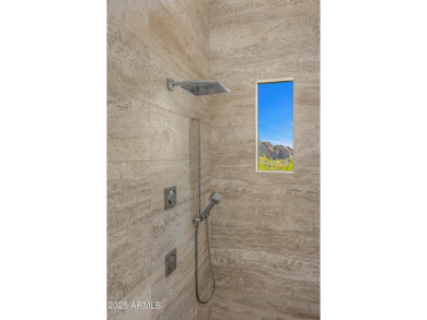 Positioned on a serene hillside Paradise Reserve, this modern