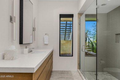 Positioned on a serene hillside Paradise Reserve, this modern