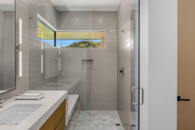 Positioned on a serene hillside Paradise Reserve, this modern