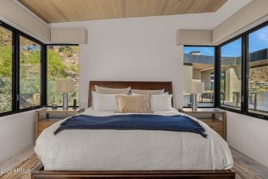 Positioned on a serene hillside Paradise Reserve, this modern