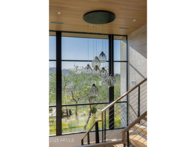 Positioned on a serene hillside Paradise Reserve, this modern