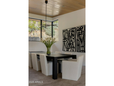 Positioned on a serene hillside Paradise Reserve, this modern