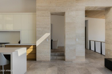 Positioned on a serene hillside Paradise Reserve, this modern